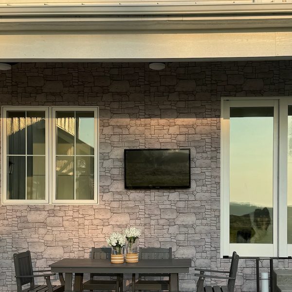 Stone veneer feature wall on a covered patio